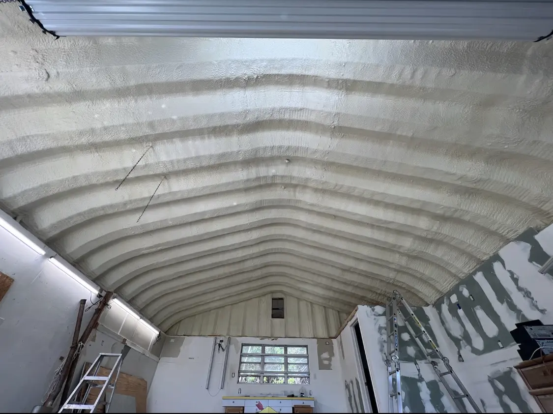 Spray polyurethane foam applied to the underside of a metal roof deck in Skippack